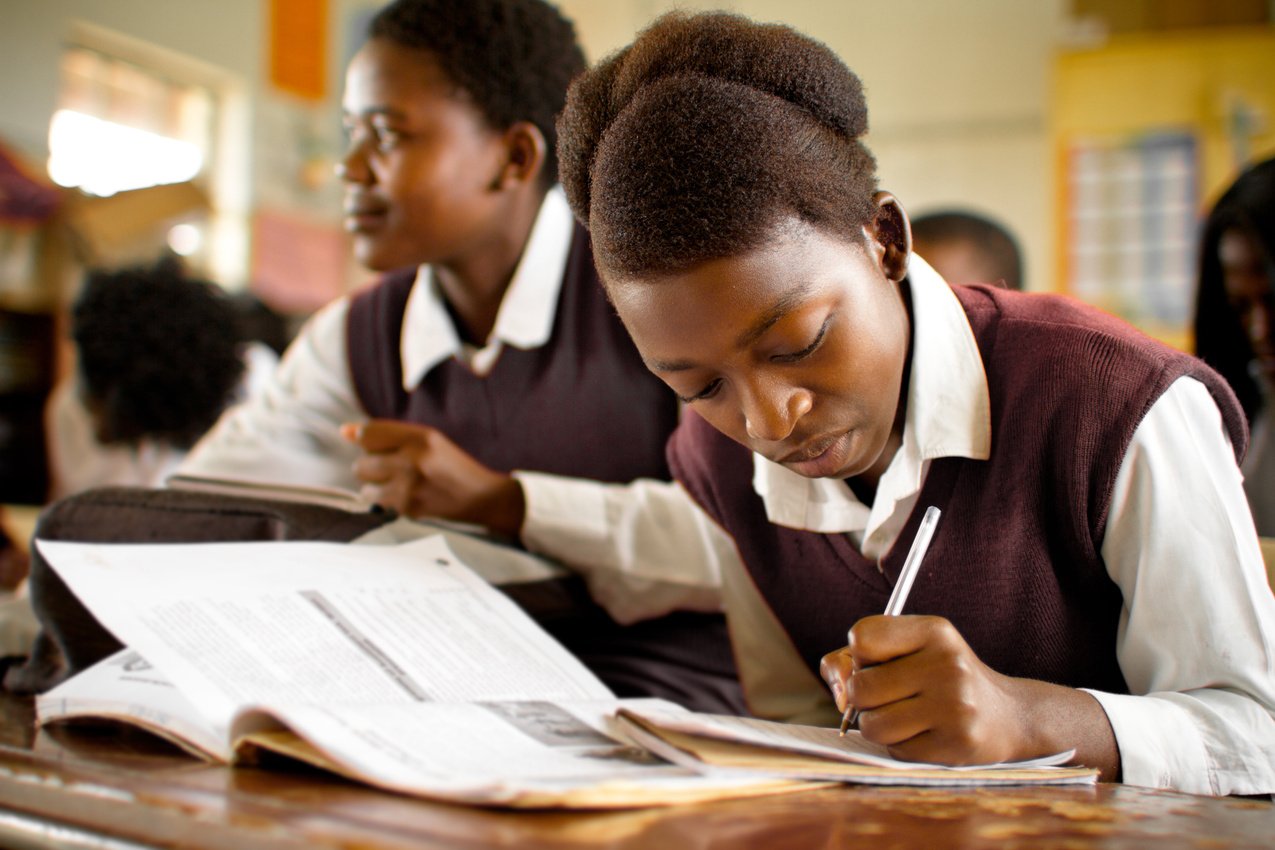 Portrait of South African girls studying in a rural classroom